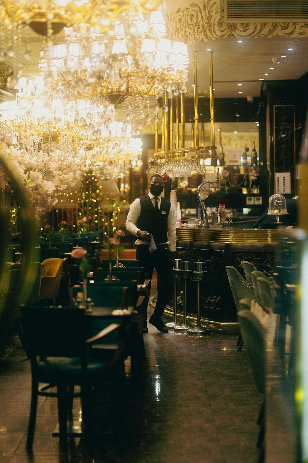 a restaurant with a chandelier hanging from the ceiling