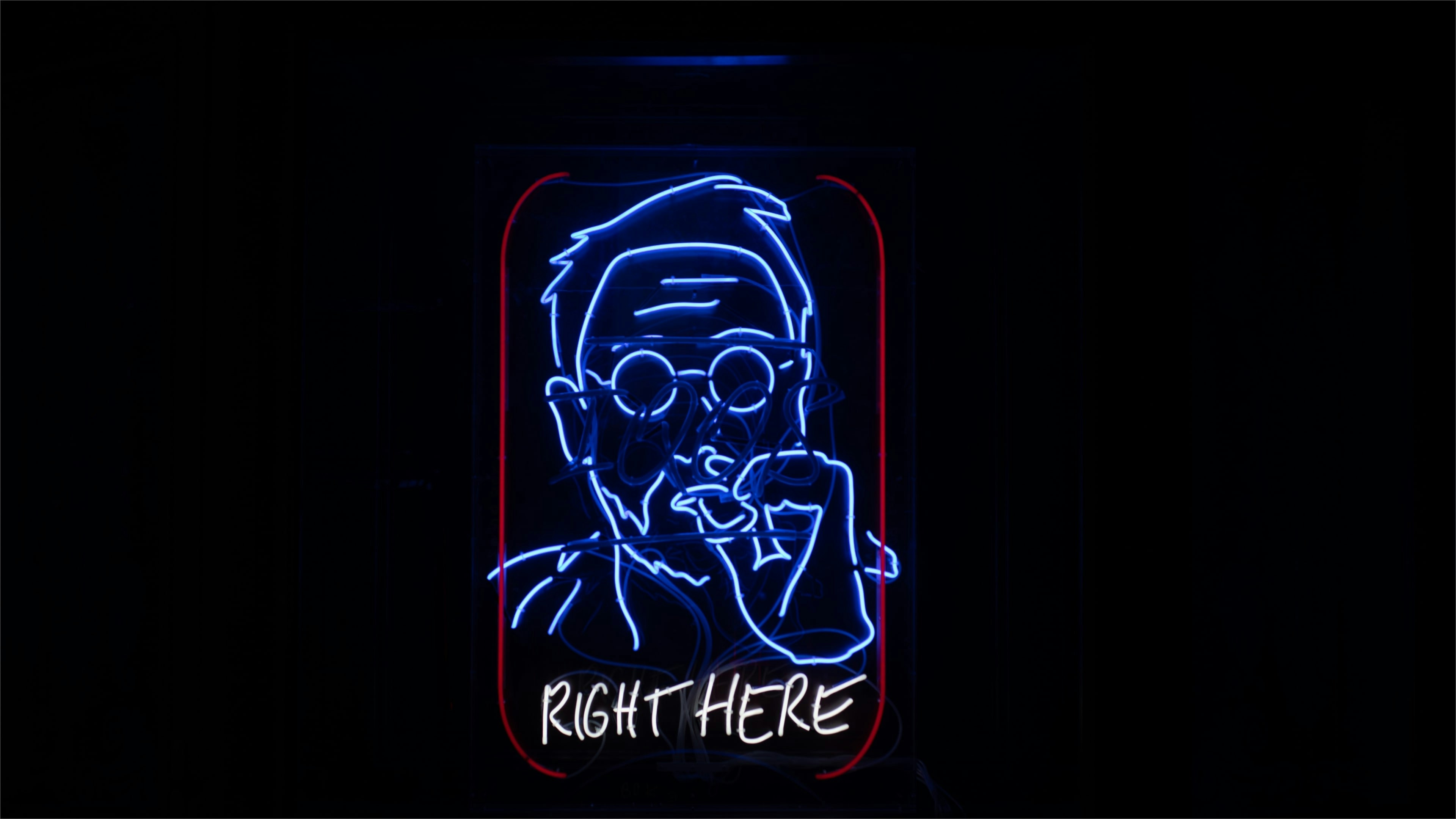 a neon sign with a picture of a man smoking a cigarette