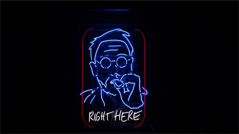 a neon sign with a picture of a man smoking a cigarette