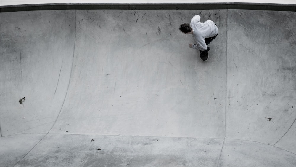 a man riding a skateboard up the side of a ramp