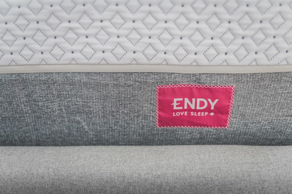 Close-up of mattress edge showing fitted protector skirt