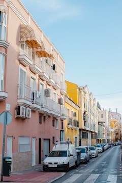 a row of parked cars on a city street