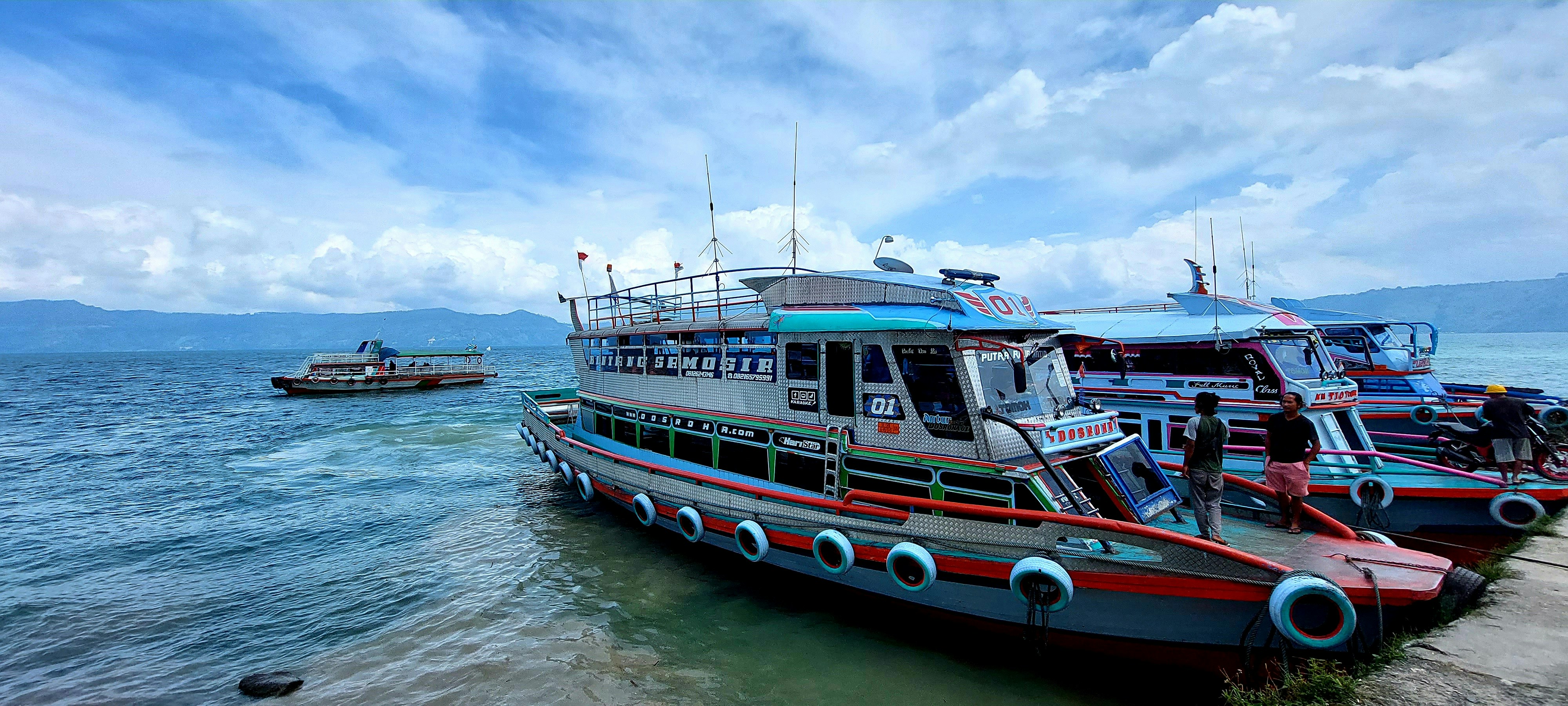 a group of boats that are sitting in the water