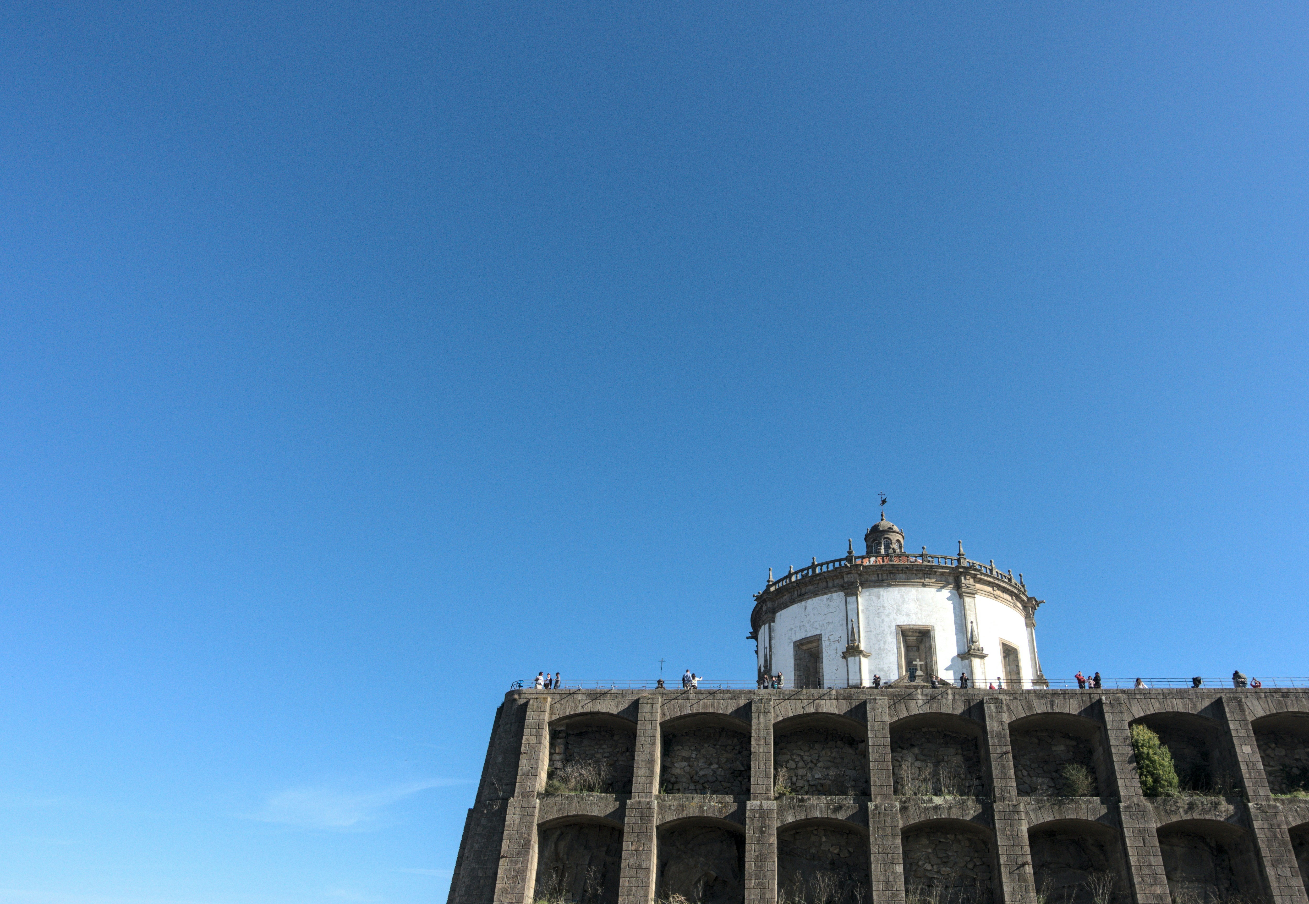 a tall building with a dome on top of it