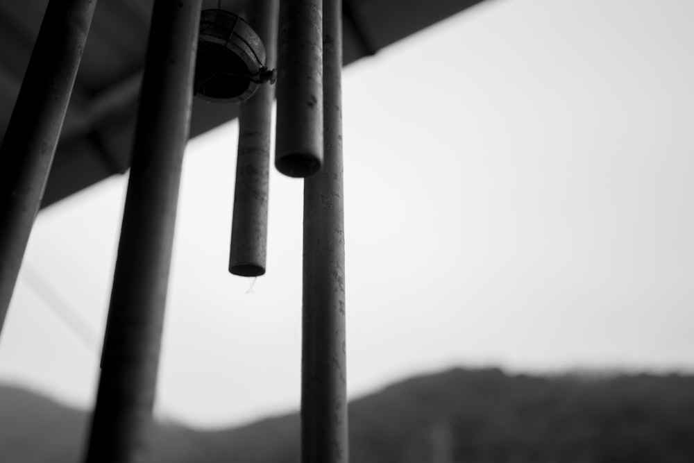 a black and white photo of a wind chime