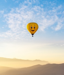 a hot air balloon with a smiley face on it