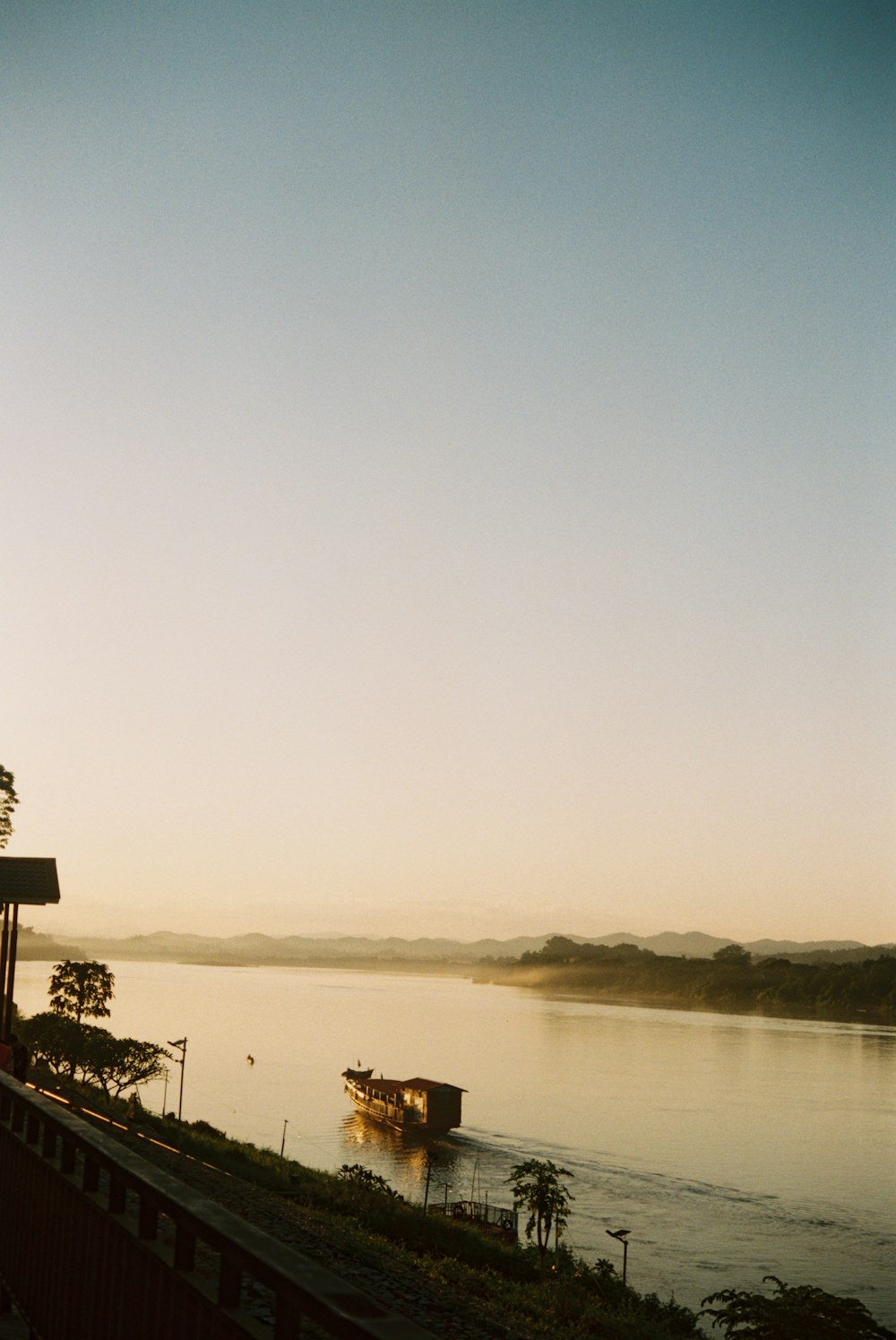 a boat is on the water at sunset