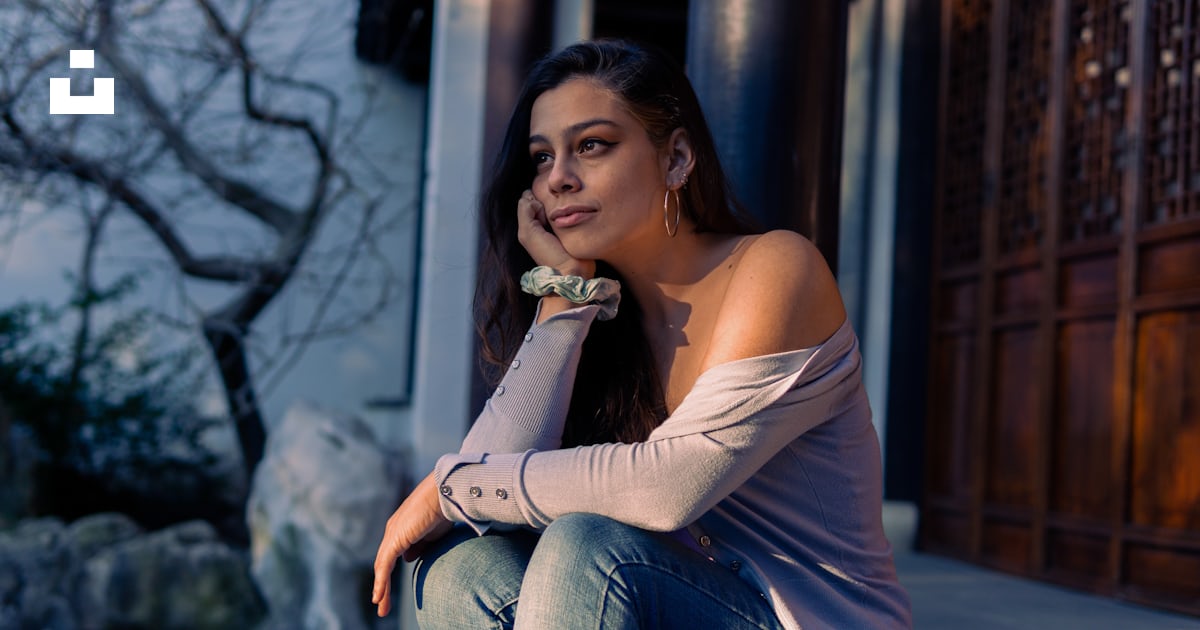A Woman Sitting On The Ground With Her Hand On Her Chin Photo Free Clothing Image On Unsplash A Woman Sitting On The Ground With Her Hand On Her Chin Photo Free Clothing Image On Unsplash