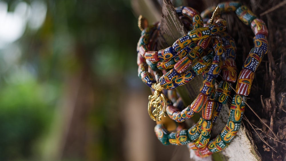 a bunch of bracelets hanging from a tree