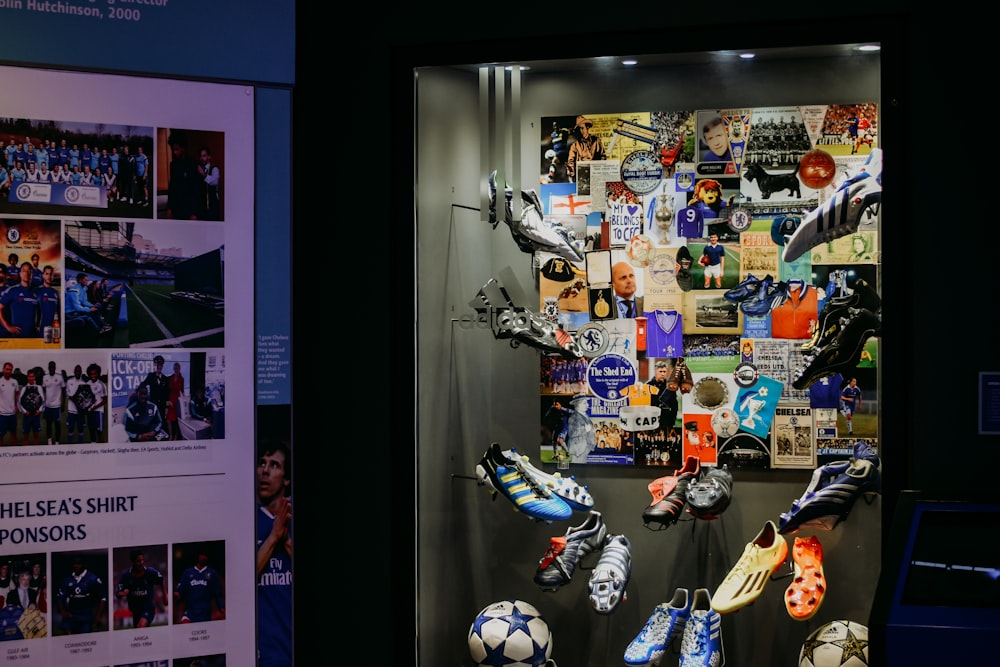 a display case filled with lots of soccer shoes