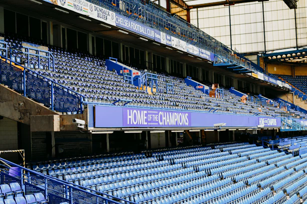 a stadium filled with lots of blue seats