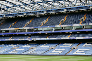 a stadium filled with lots of blue seats