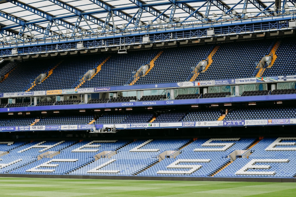 a stadium filled with lots of blue seats