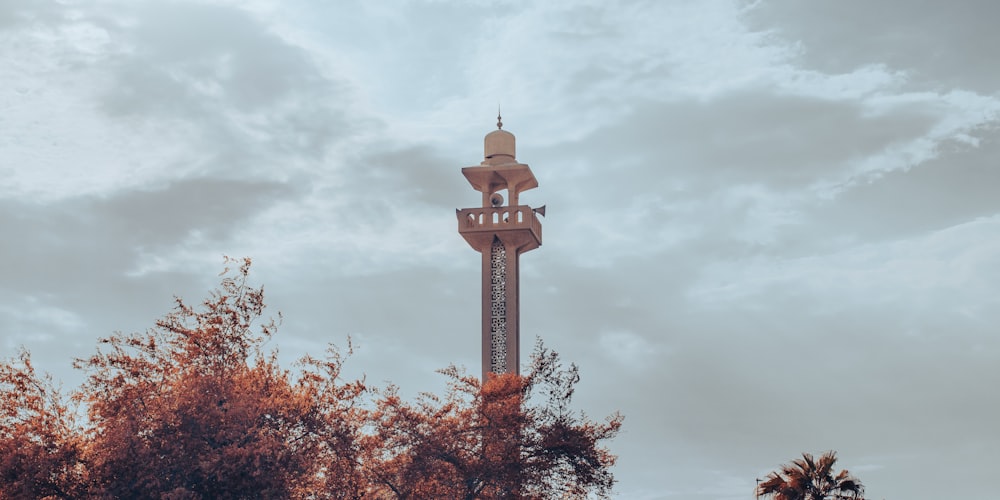 a tall tower with a clock on the top of it