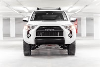 a white truck parked in a parking garage