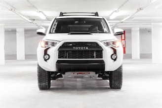 a white truck parked in a parking garage
