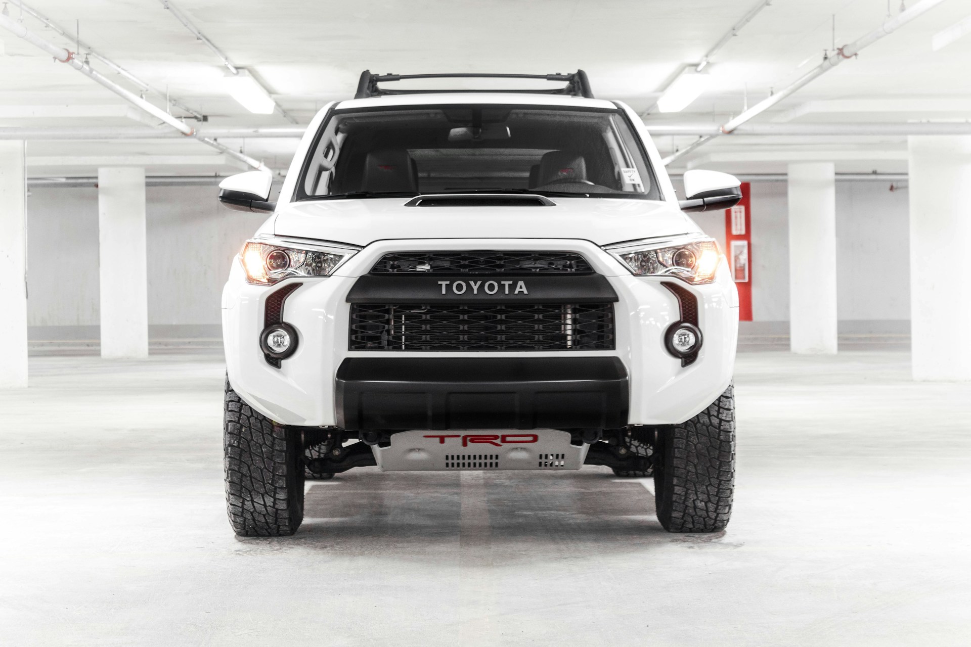 a white truck parked in a parking garage