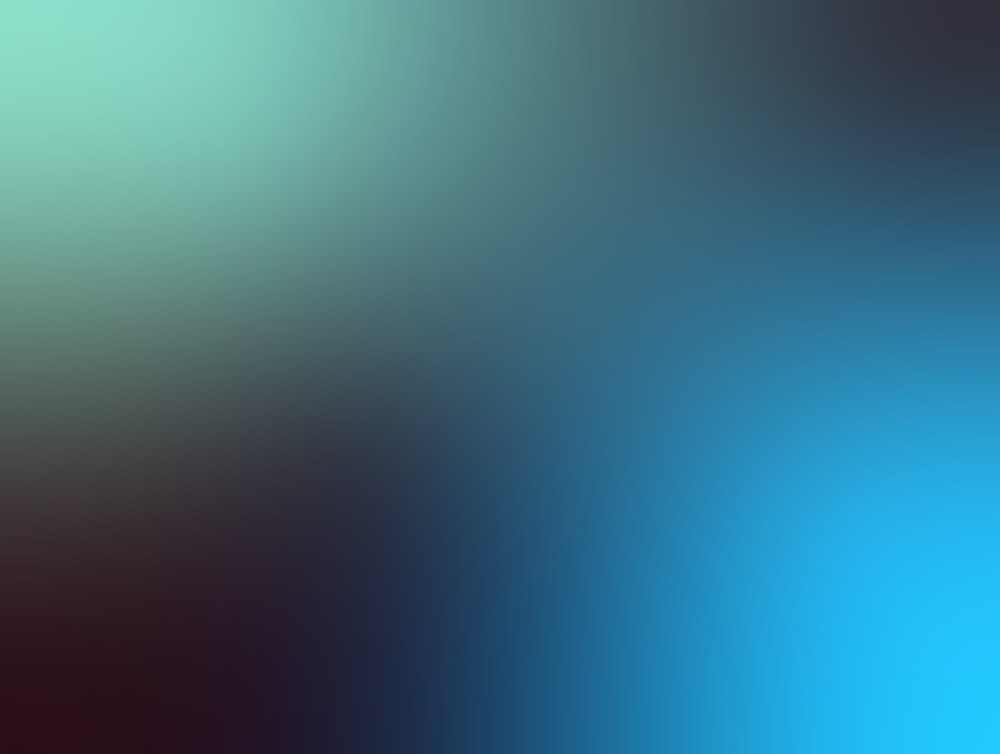 a blurry image of a blue and green background