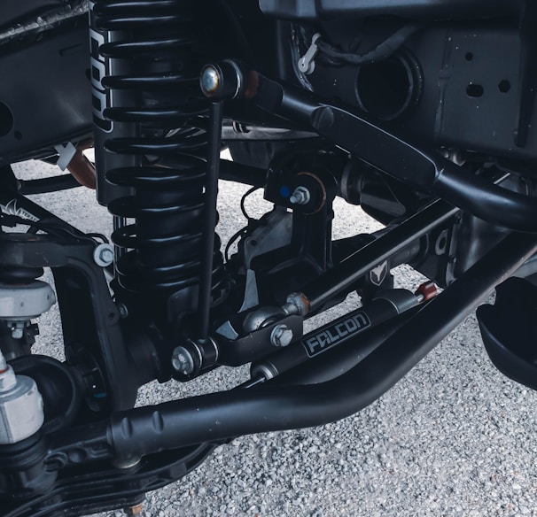 a close up of the front suspension of a motorcycle