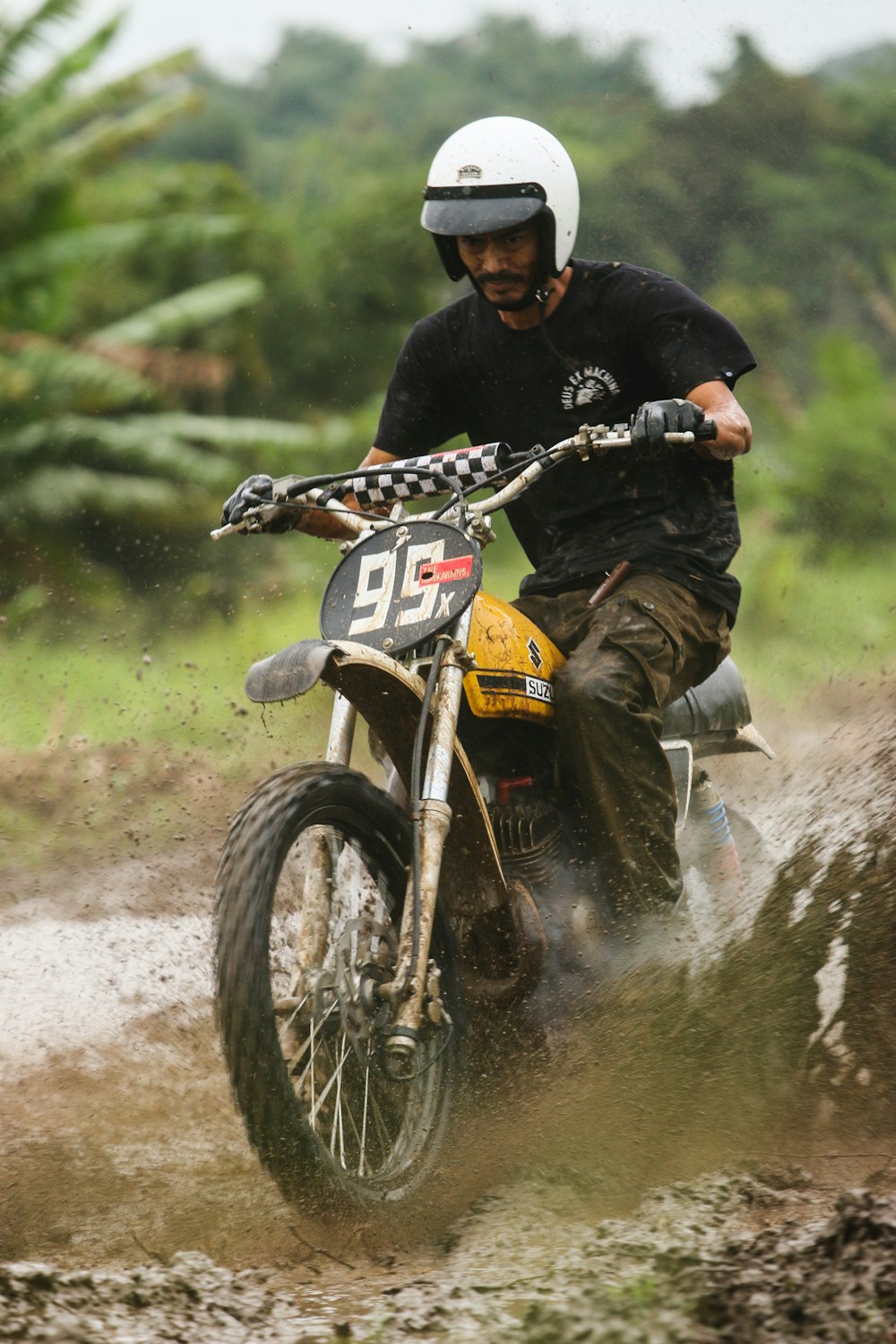 a man riding on the back of a dirt bike