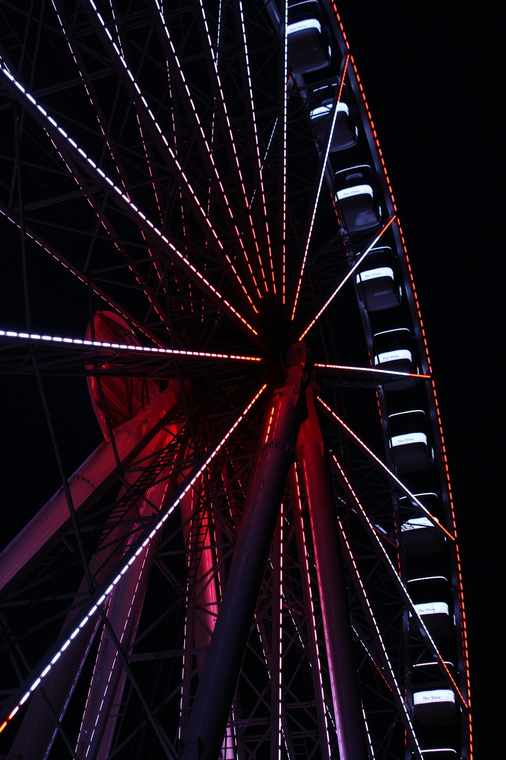 a large ferris wheel lit up at night