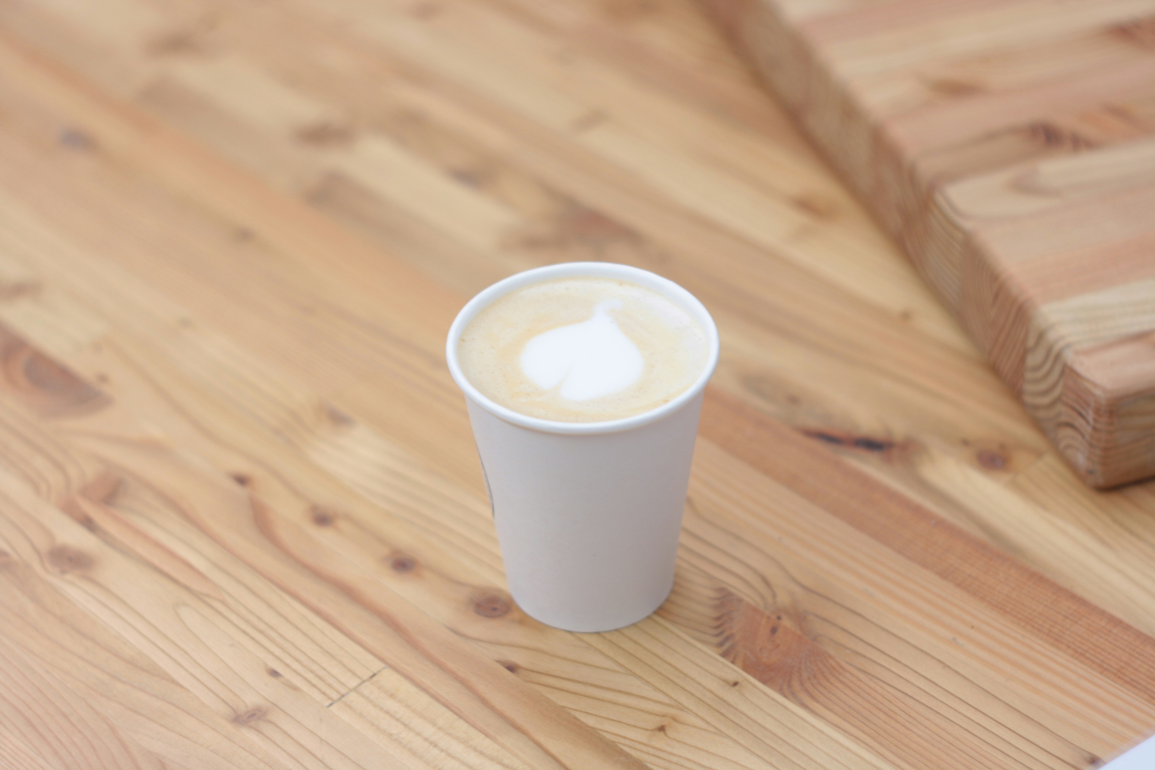 Mockup of two designed paper cups.