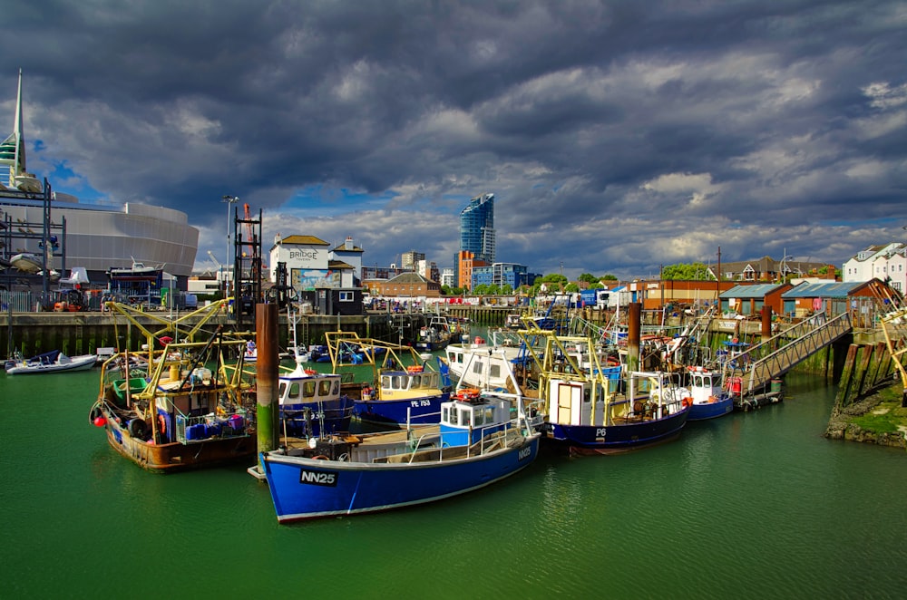 a group of boats that are sitting in the water