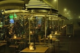 An outdoor café with stylish sun protection films.