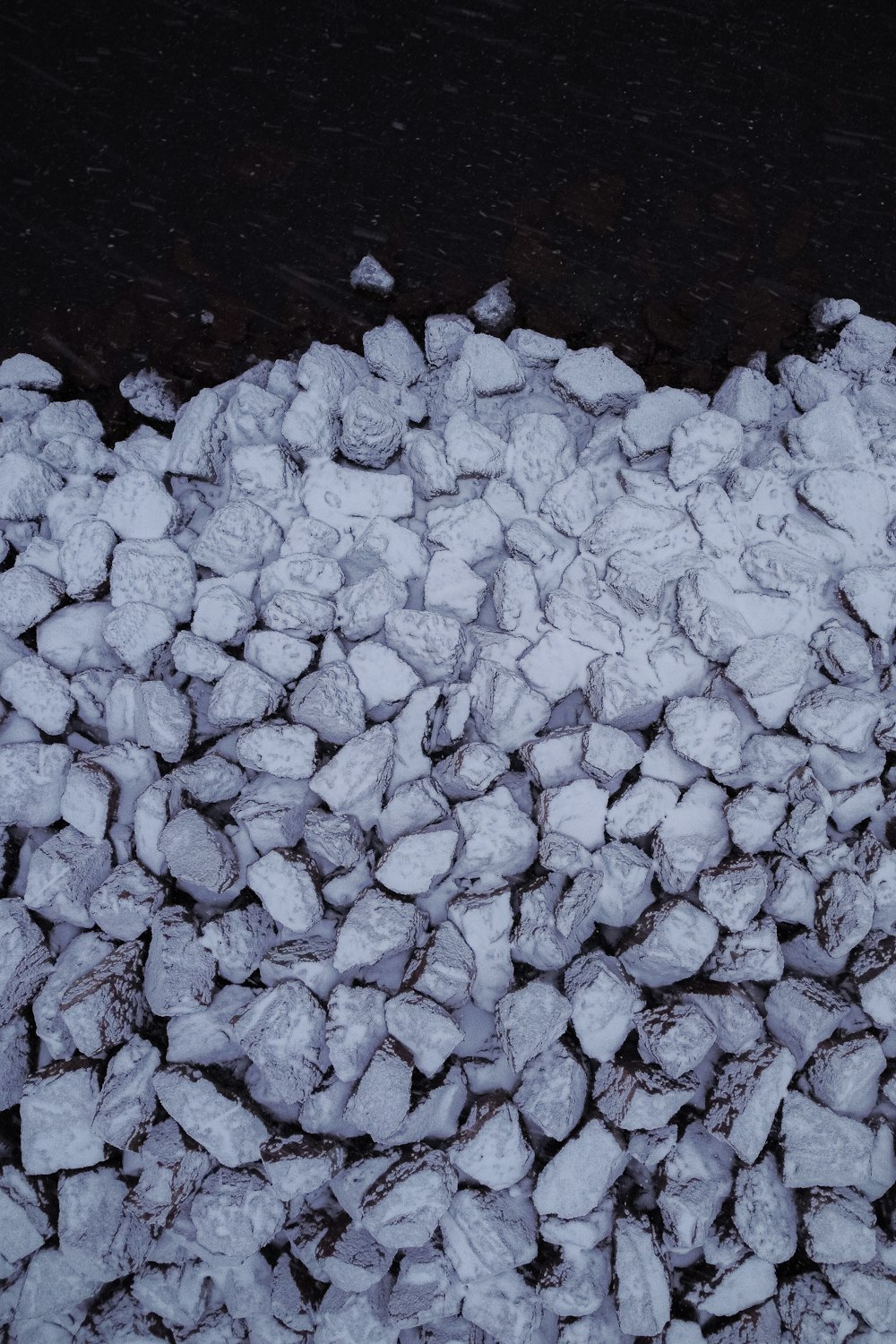 a bunch of rocks that are covered in snow