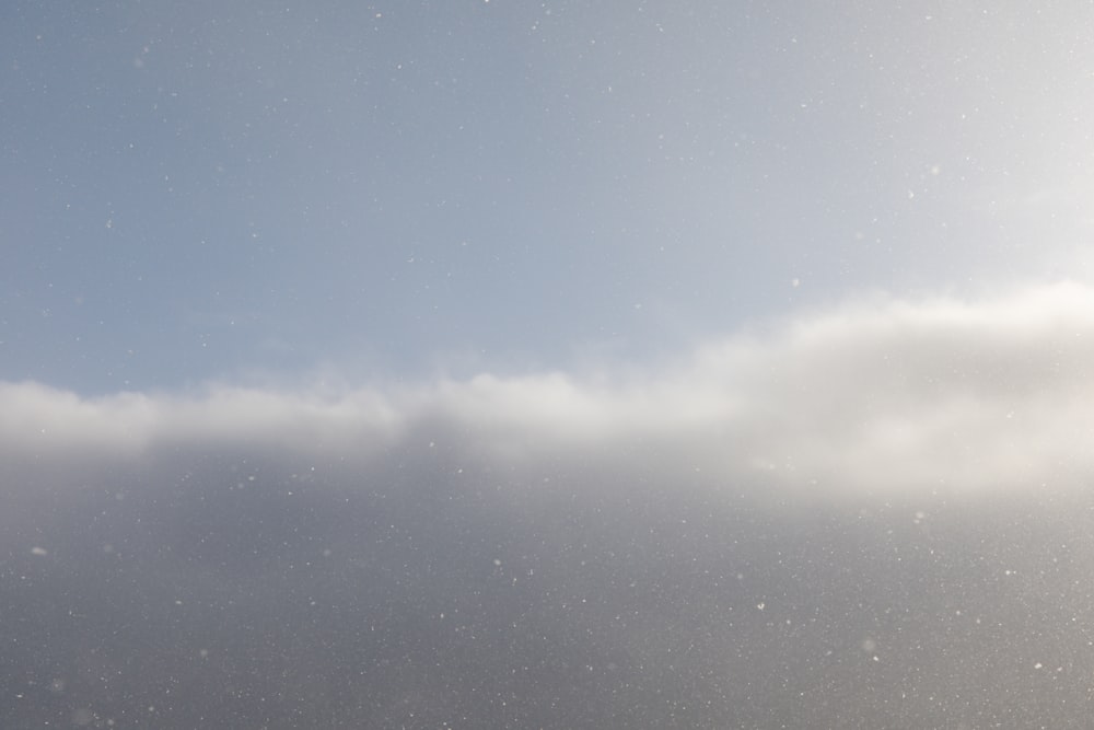 a person on a snowboard in the snow