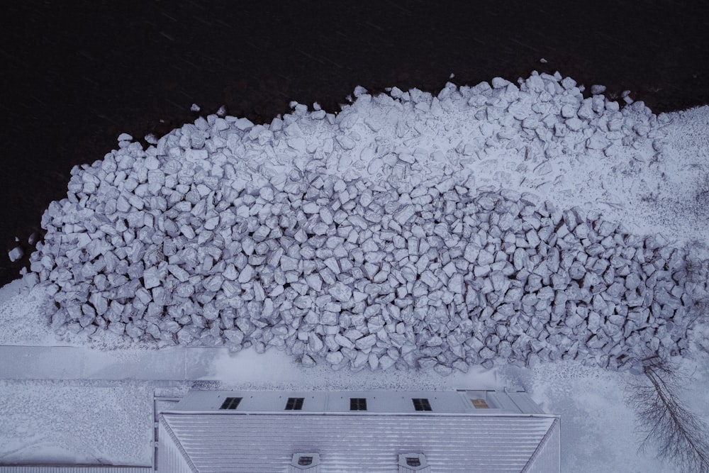 a large pile of snow next to a building