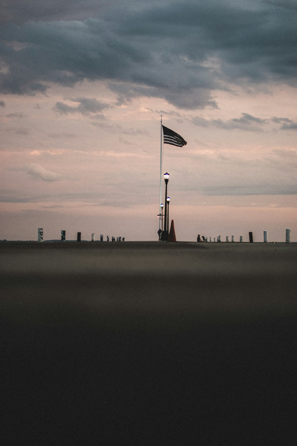 a flag pole with a flag on top of it