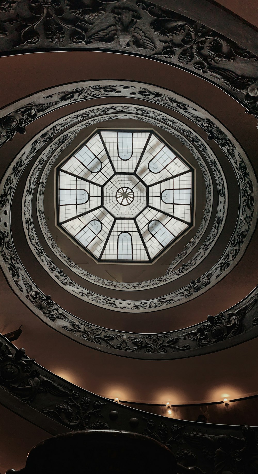 a ceiling with a circular glass window in it