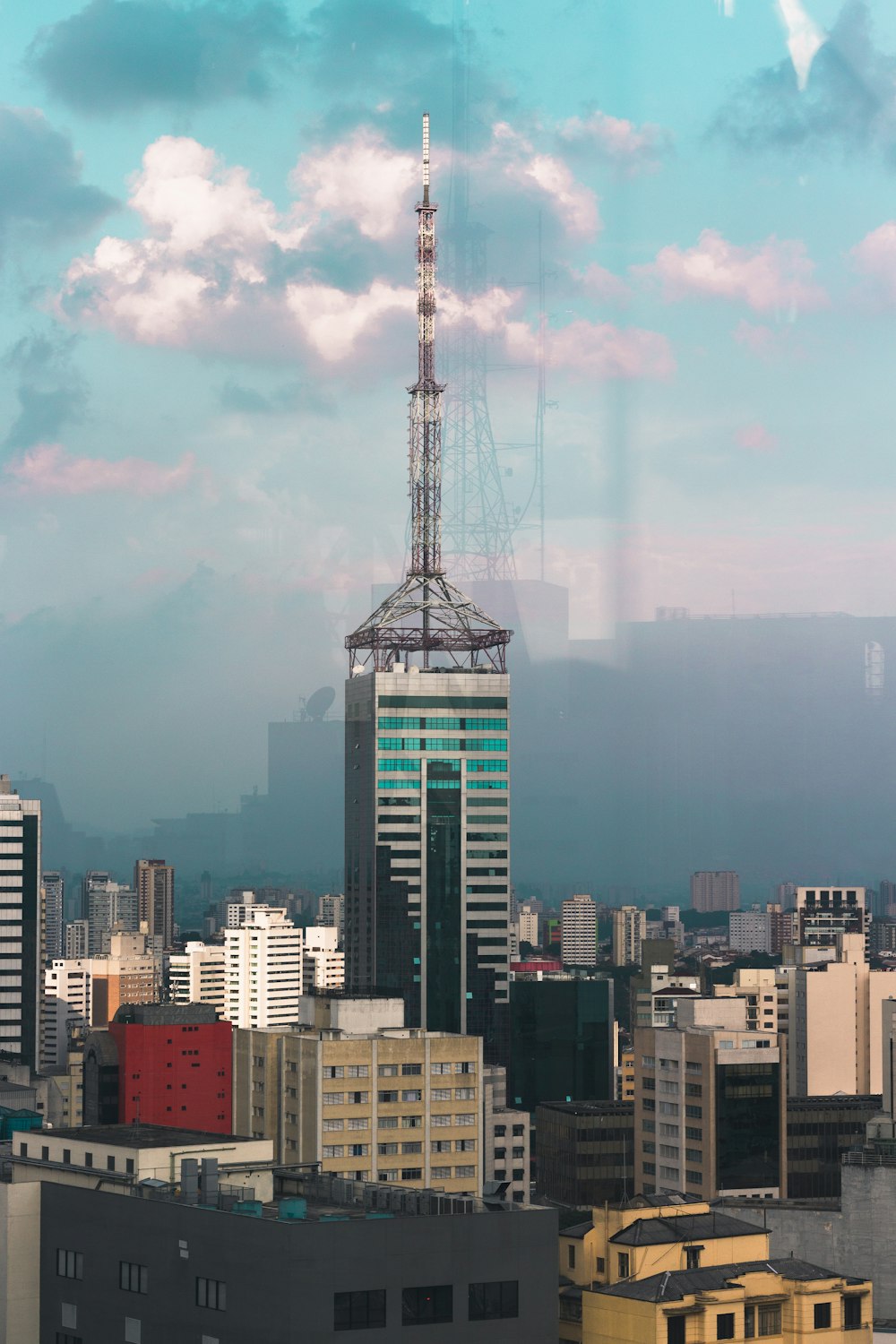 a view of a very tall building in a city