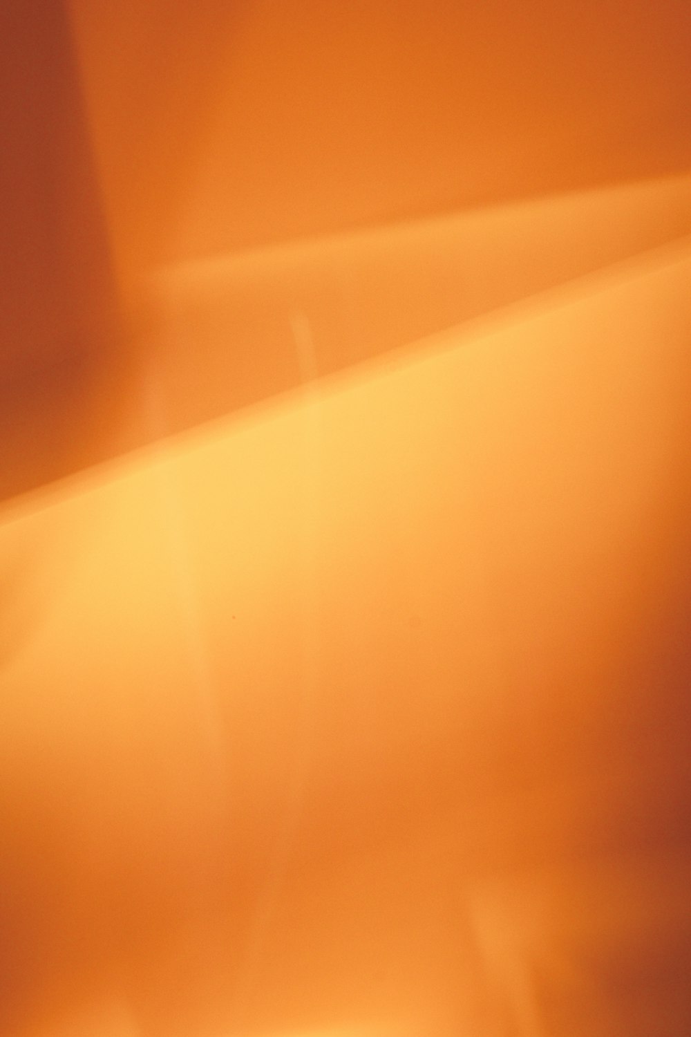 a blurry image of an orange wall