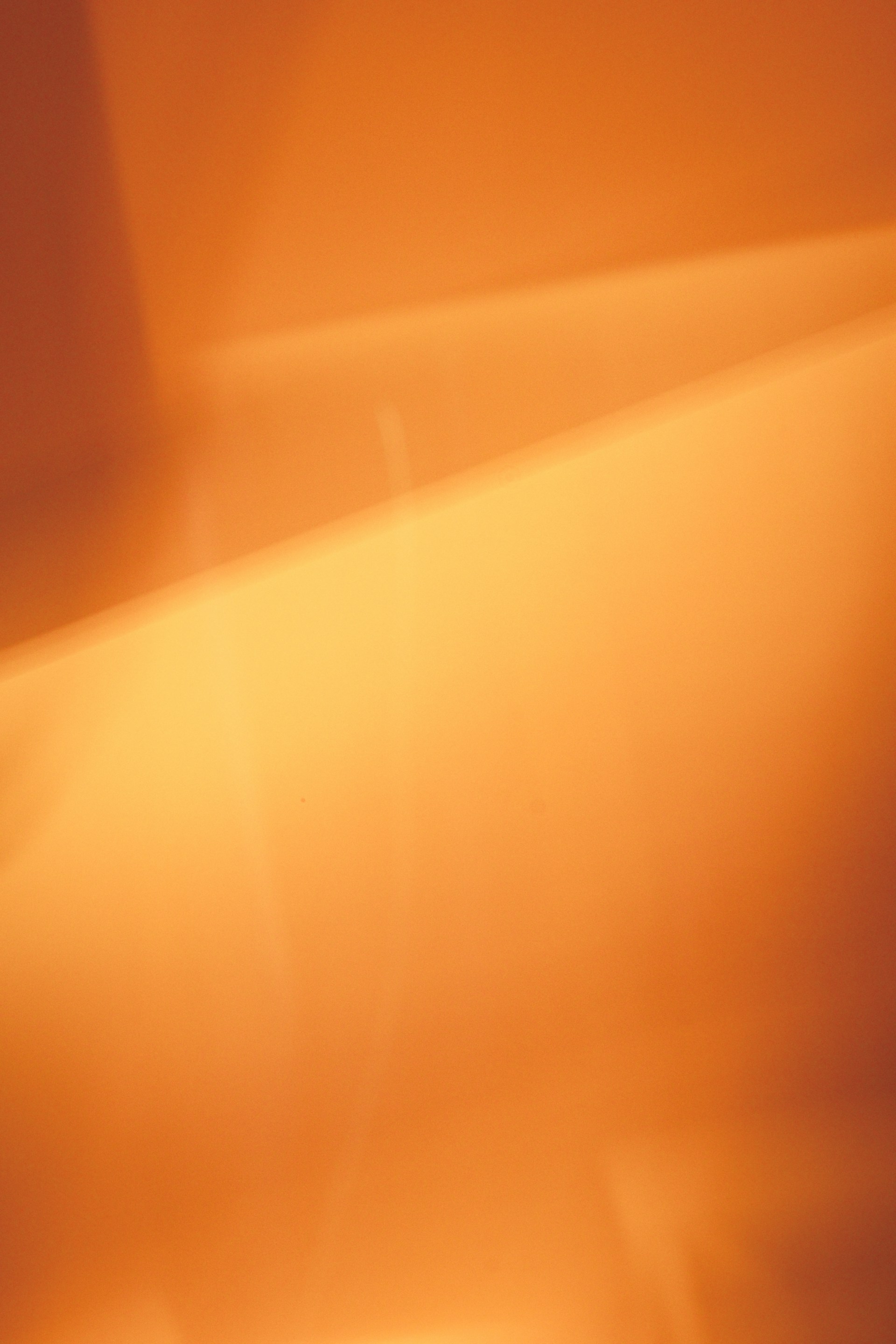 a blurry image of an orange wall
