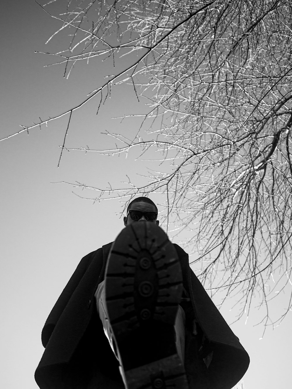 a black and white photo of a street light