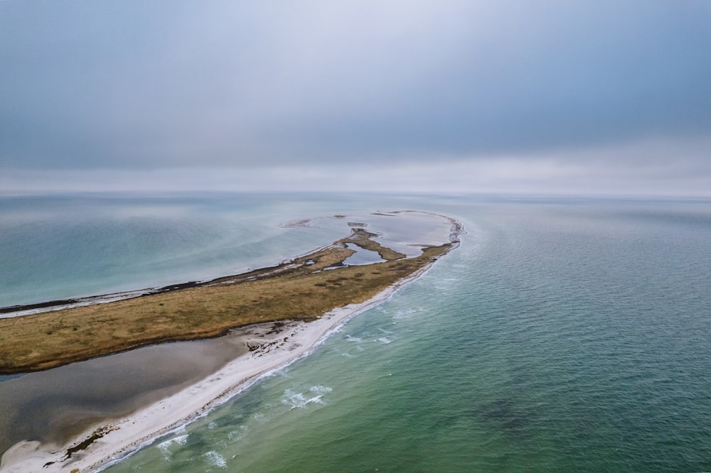 an aerial view of an island in the middle of the ocean