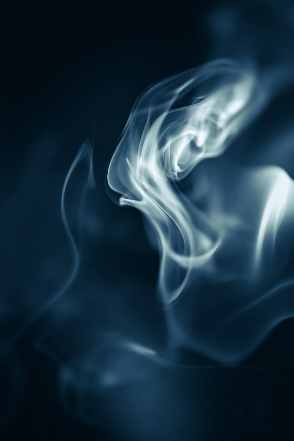 a blue smoke background with a black background