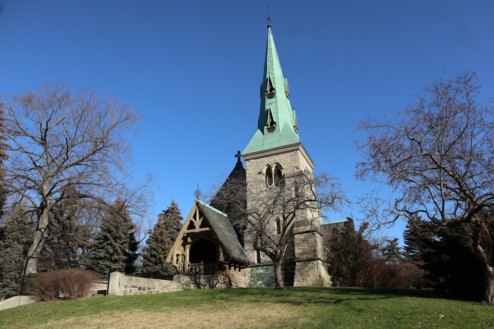 a church with a steeple on a hill