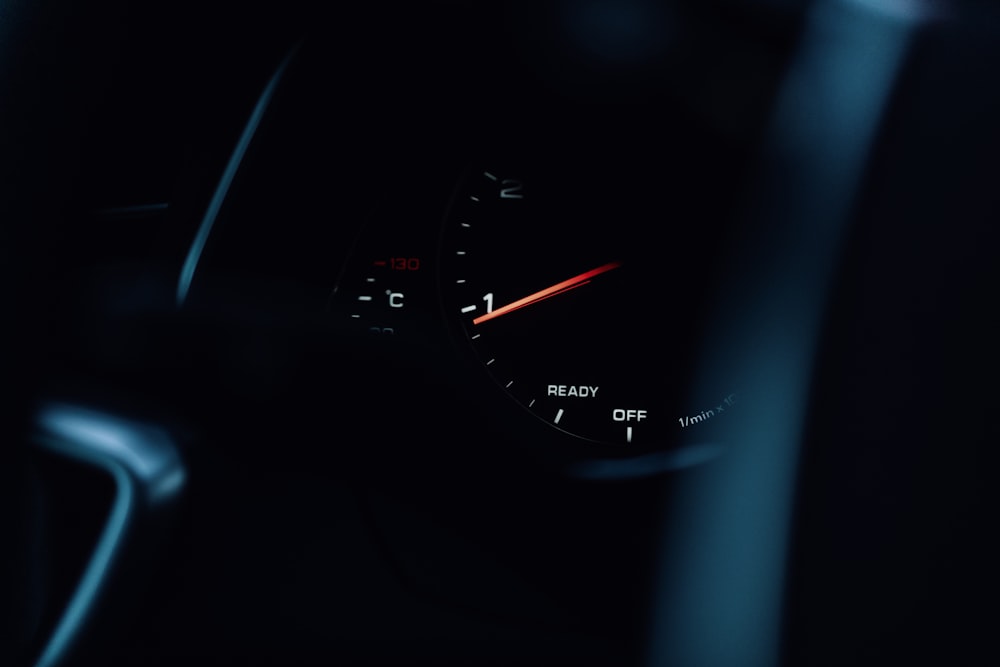 the dashboard of a car in the dark