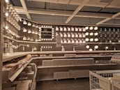 Display of artistic architectural lights in a showroom setting.