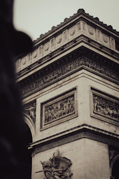 Close-up of detailed colonial-era architectural carvings being restored.