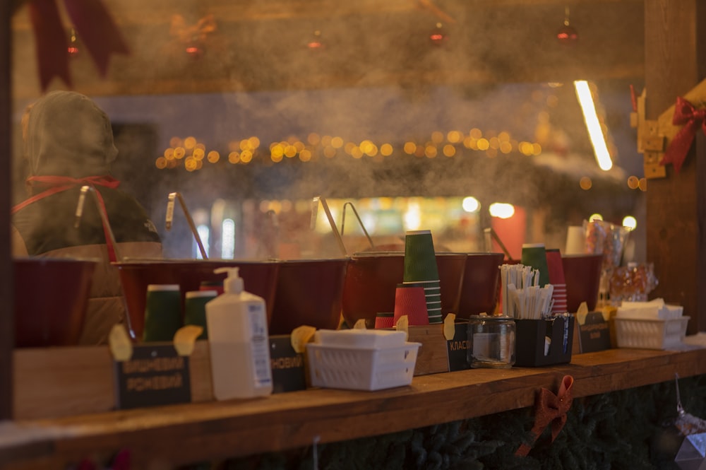 a display of hot dogs and condiments on a table