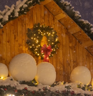 a house with a christmas wreath and lights on it