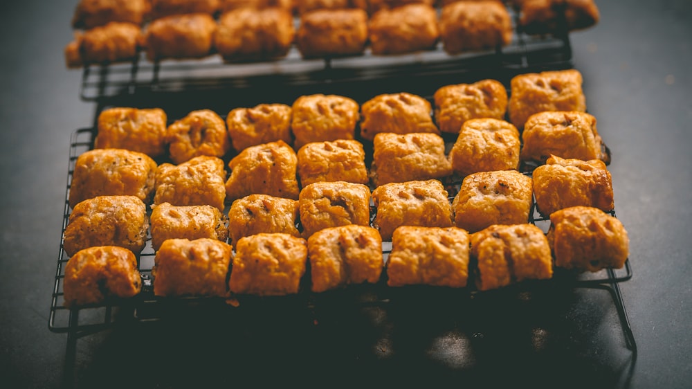 a couple of trays of food sitting on a table