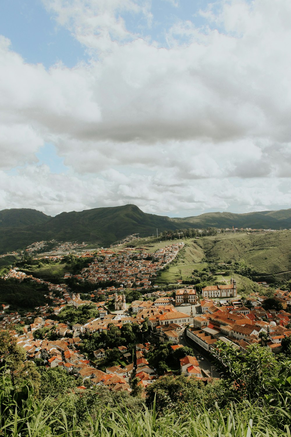 a view of a city from the top of a hill