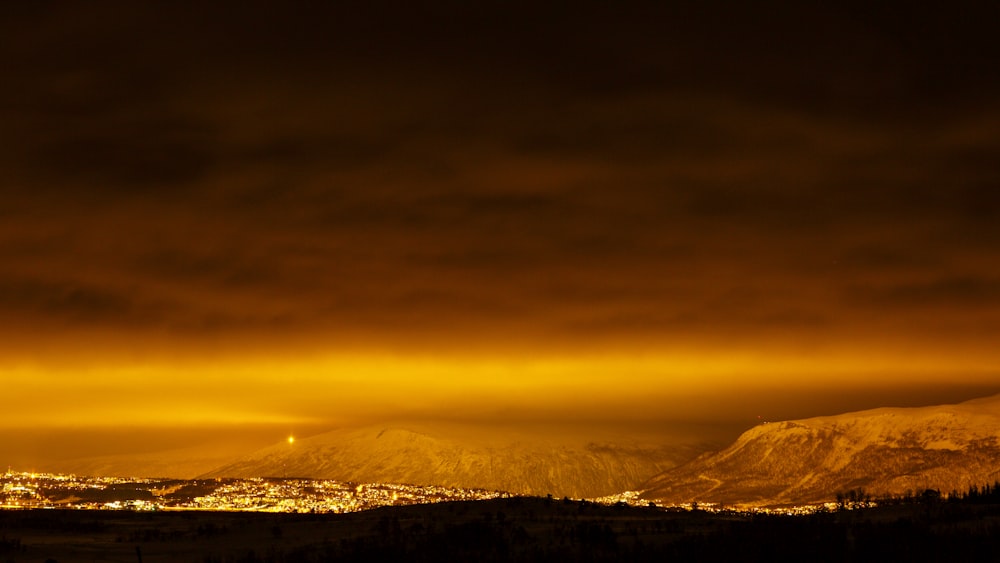 a view of a city at night from a distance