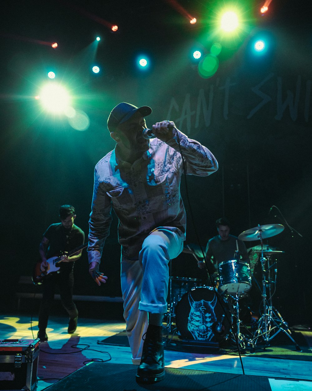 a man standing on a stage with a microphone