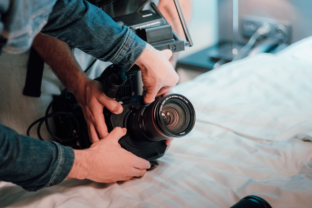 a man is holding a camera and taking a picture